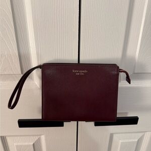 Kate Spade Morgan Gusseted Wristlet in Cordovan (a deep berry or burgundy color)